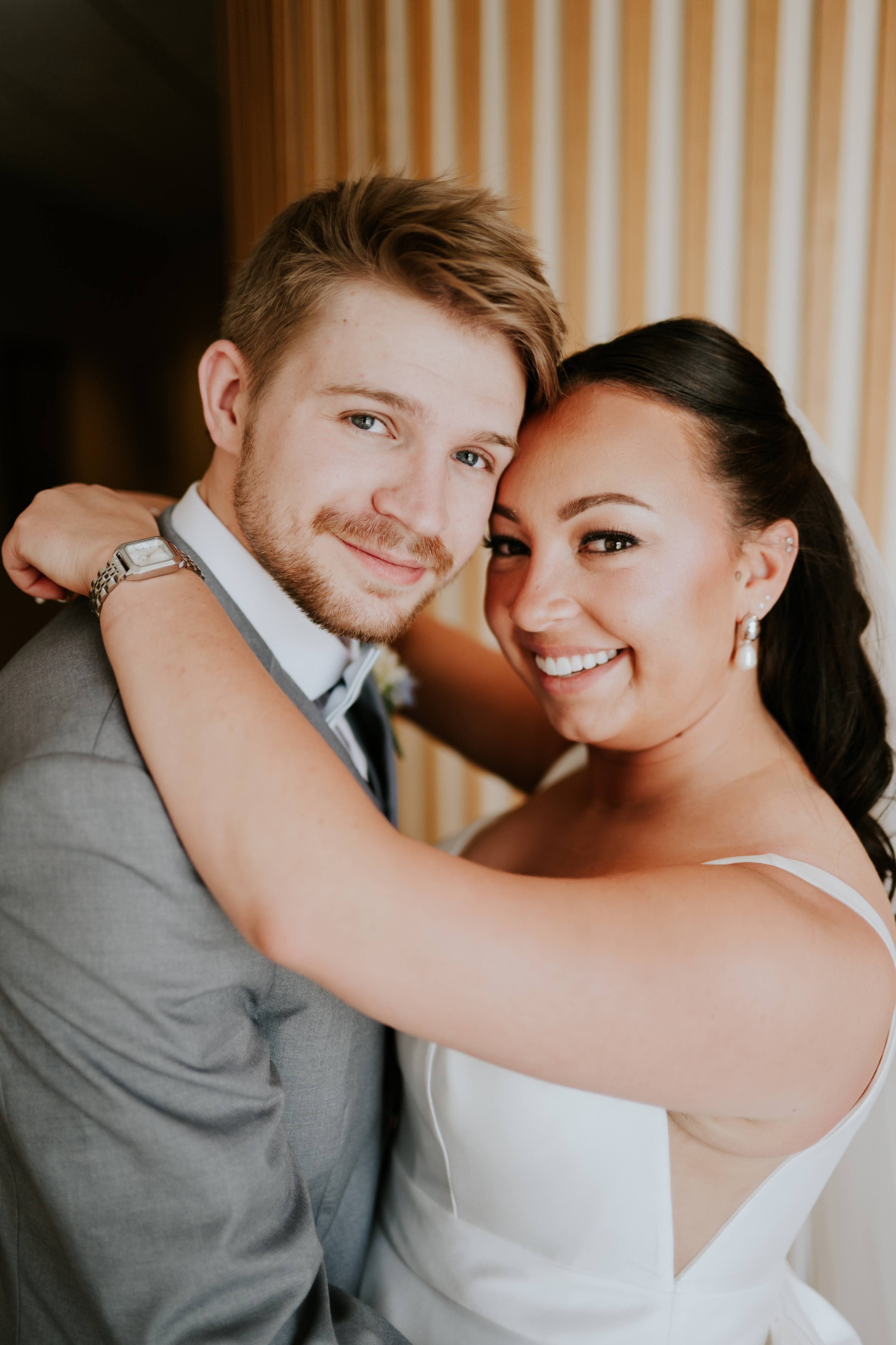 Jude and Erin sharing a wedding-day embrace.
